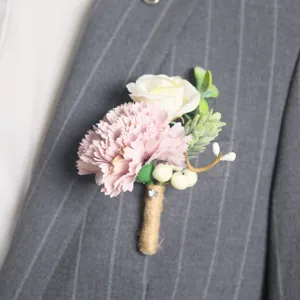 Close-up detail shot of the forest style artificial carnation boutonniere with leaves.