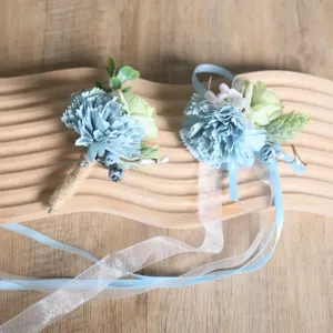 Blue artificial carnation boutonnière and wrist corsage set for wedding party floral accessories.