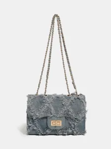 Stylish denim chain crossbody bag with frayed diamond quilted design for daily commuting.