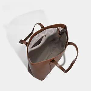 Brown large capacity PU leather tote bag interior detail view daily commute shoulder bag