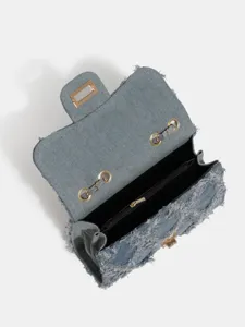 Trendy denim chain shoulder bag for women, featuring a chic frayed flap design.