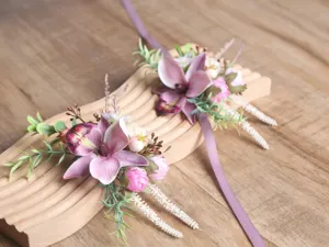 Detail view of forest style pink purple artificial orchid wedding corsage wrist flower.