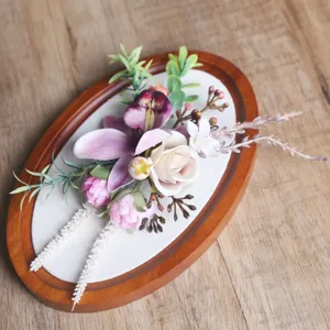 Detailed view of forest style pink purple corsage wrist flower wedding floral arrangement