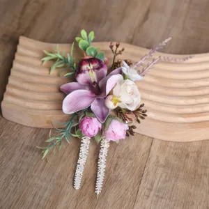 Detailed view of forest style pink purple artificial flower corsage with orchid and rose.