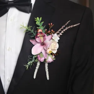 Elegant pink purple wedding boutonniere for groom, artificial floral lapel pin for celebration.