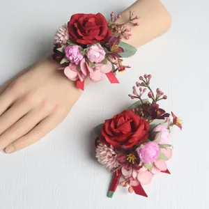 Kunstblumen Handkorsage und Ansteckblume Set mit roten und rosa Rosen fuer Hochzeitsdeko.