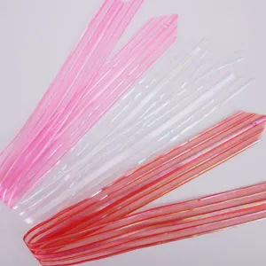 Detailed view of colorful translucent decorative ribbons, perfect for gift wrapping and parties.