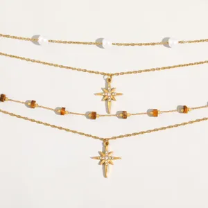 Multi-layer gold-colored stainless steel necklace featuring pearls and star pendants.