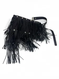 Close-up view of the black multi-layer fringe leather belt with punk rivets detail.