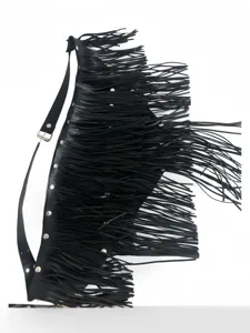 Black punk fringe belt detail showing layered leather tassels and metal rivet decorations.
