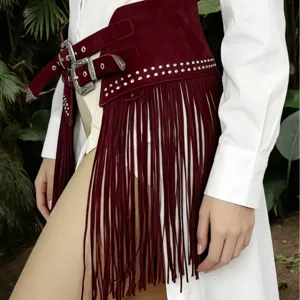 Burgundy suede fringe wide belt with double buckles and metallic studs for bohemian fashion.