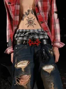 Punk style vintage metal belt with red star buckle, cool distressed streetwear accessory.