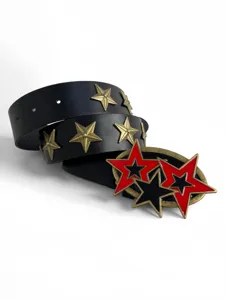 Detail shot of punk black leather belt with antique bronze and striking red black stars.