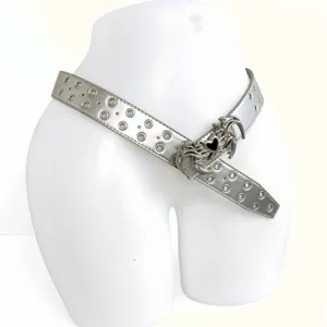 Close-up of the Y2K gothic silver metallic heart buckle belt with double row eyelets.
