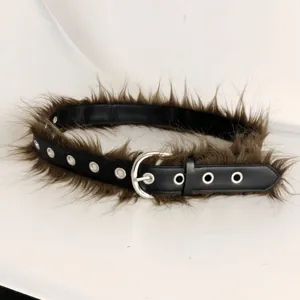 Detailed view of the black grommet belt featuring unique brown faux fur trim edges.