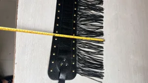 Black faux leather fringe waist belt with gold studs, retro punk style, perfect for dance and stage.