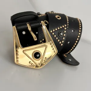 Punk style black leather belt with ornate gold metal buckle and sparkling rhinestones for women