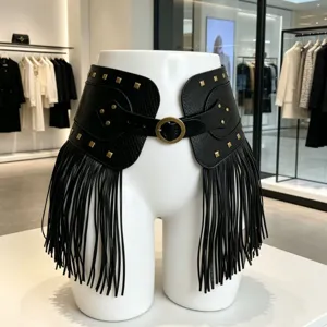 Black faux leather fringe waist belt with metal rivets and buckle for punk style fashion.