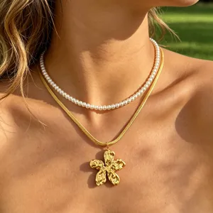 Double layer pearl and gold flower pendant necklace, chic snake chain jewelry for women.