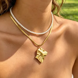 Gold double layer necklace with pearl choker and irregular pendant for women fashion jewelry.