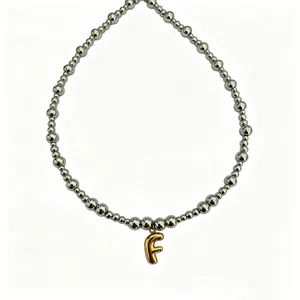 Stainless steel bead necklace with gold bubble letter F pendant stylish clavicle chain.