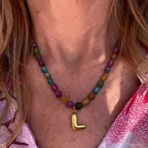Colorful beaded necklace with stainless steel letter L pendant, elegant daily jewelry detail.