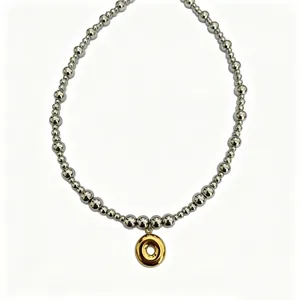 Stainless steel beaded necklace with gold doughnut pendant chic clavicle chain detail