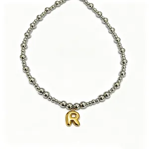 Stainless steel beaded necklace with gold puffy letter R pendant for daily fashion wear.
