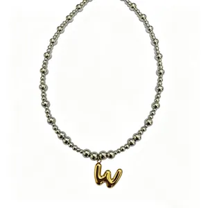 Stainless steel beaded necklace with gold puffy letter pendant, fashion clavicle jewelry.