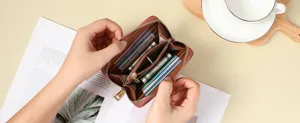 Brown leather zippered card wallet with multiple slots for organizing cards and cash efficiently.