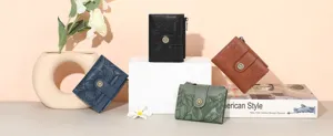 Detailed view of women short embossed floral wallet featuring snap closure and coin pouch.