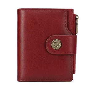 Red leather women wallet detail view with metal sunflower snap and side zipper pocket.