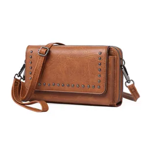 Vintage brown PU leather crossbody phone bag for women, multi-compartment wallet with metal studs.