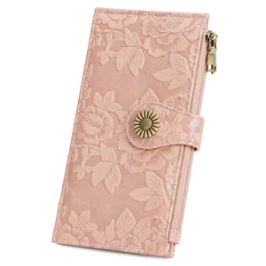 Embossed floral long wallet for women with sunflower snap button and zipper, detail view.