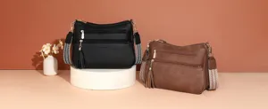 Multi-pocket women shoulder bag PU leather crossbody handbag with wide strap and tassel decor.
