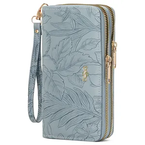 Women's long double zipper wallet clutch with elegant leaf embossed pattern and wrist strap.