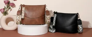 Detailed view of stylish women bucket shoulder bags in brown and black with wide straps.