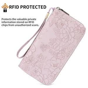 Pink floral embossed women's long wallet with wrist strap and secure zip-around closure.