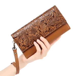 Details of retro embossed women long wallet with wrist strap and floral carved pattern.