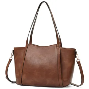Brown leather tote bag detail featuring sturdy handles, smooth texture and spacious interior.