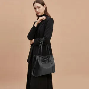 Classic black leather tote bag for women, spacious minimalist daily shoulder bag.