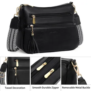 Black PU leather crossbody shoulder bag with multi zippers, tassels and wide strap for women.