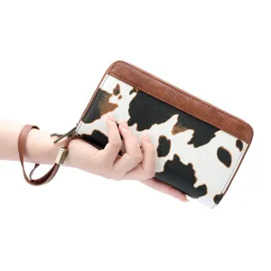 Women cow print long wallet clutch with wrist strap, double zipper design, large capacity.