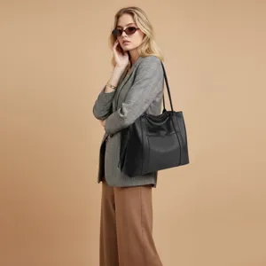 Black leather tote bag for women, large capacity stylish shoulder bag for daily commuting.