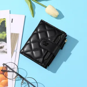 Black quilted short wallet with camellia button detail, elegant multi-card zip purse.