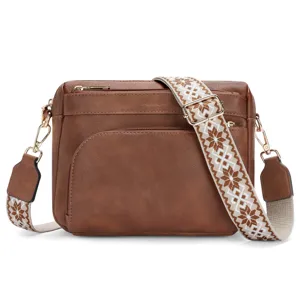 Brown crossbody bag for women, multi-pocket PU leather shoulder handbag with wide woven strap.