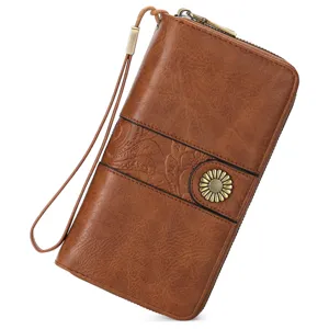 Women brown PU leather long wallet retro clutch purse with wrist strap and floral metal snap.
