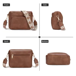 Brown leather crossbody bag with wide patterned strap, multi-pocket design and zip closure.