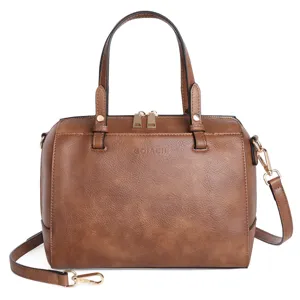Brown PU leather casual handbag detail featuring top handles, golden zipper and strap.