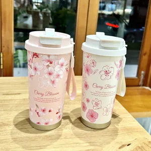 Cherry blossom stainless steel thermal tumbler, portable straw cup detail view showcase.